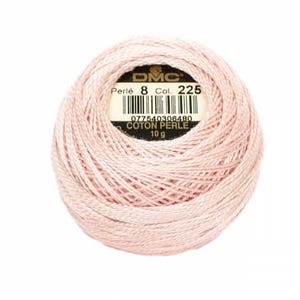 May include: A pink ball of DMC Perle Cotton embroidery floss, size 8, color 225. The label reads "DMC Perle 8 Col. 225 077540306480 Coton Perle 10g".
