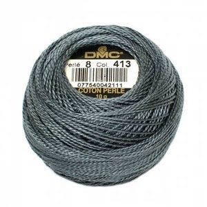 May include: A skein of DMC Perle Cotton embroidery floss in color 413, a dark gray shade. The skein is labeled with the DMC logo, the thread number, and the weight (10g).