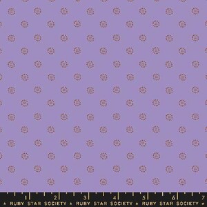 May include: Purple fabric with a repeating pattern of small, red, stylized sunbursts.