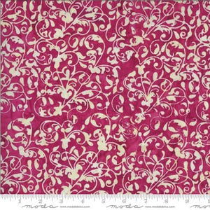 May include: A close-up of a fabric with a repeating pattern of cream-colored, swirling vines and leaves against a deep magenta background. The fabric is marked with a ruler along the bottom edge, showing inch measurements.