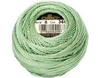 May include: A skein of DMC Perle Cotton embroidery floss in color 368, a light green shade. The skein is labeled with the DMC logo, "Perle 8", "Col. 368", and a barcode.
