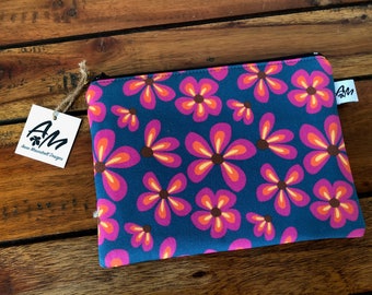 Retro flowers zipper pouch in blue, yellow and brown on a green background