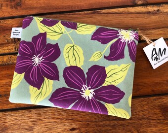 Custom print, purple clematis flowers on light green, medium sized flat, cotton zipper pouch