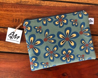 Retro flowers zipper pouch in blue, yellow and brown on a green background