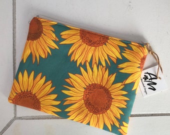 Golden yellow sunflowers on green, medium sized flat, cotton zipper pouch