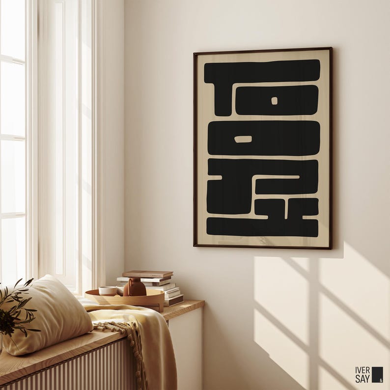 Graphic art print of “TOKYO” in black letters on a beige background.