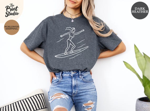 Minimalist Line Art Woman Surfing T-Shirt Hand Drawn Surf Graphic Tee Cool Summer Beach Shirt Stylish Surf Lover Gift Coastal Vibes Tee