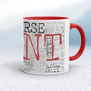 May include: White ceramic mug with a red interior and handle. The mug features the word "FINE" in large red letters, surrounded by a collage of profanity in various fonts and sizes.