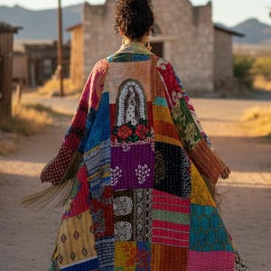 May include: A vibrant patchwork kimono, featuring a religious image on the back, worn by a person walking down a dusty road. The kimono displays a mix of patterns and colours, including red, blue, and yellow, creating a striking visual.