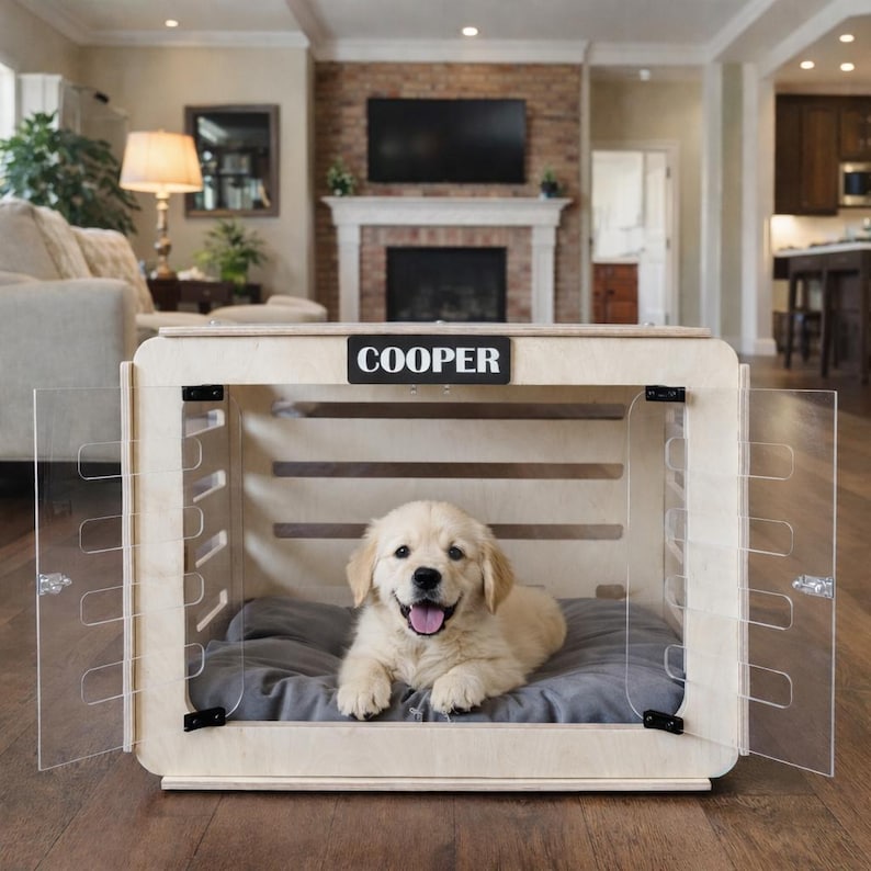 A modern indoor wooden dog house made from birch plywood, shown in a bright American living room with a young golden retriever resting inside on a soft gray cushion.
