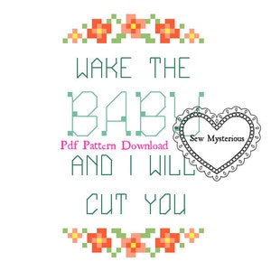 May include: Cross stitch pattern with a green and white design that says "Wake the baby and I will cut you". The pattern is surrounded by a border of orange flowers.