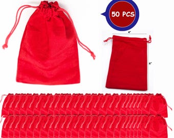 May include: Red velvet drawstring bags, 4 inches wide and 6 inches tall, with a total of 50 pieces. These small bags are ideal for jewelry, gifts, or party favors. The bags have a soft texture and a drawstring closure.