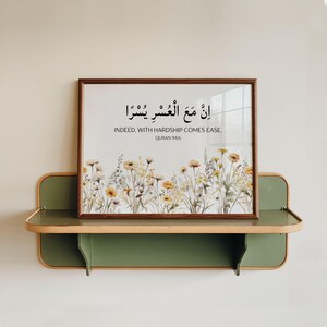 horizontal islamic wall art featuring Quran 94:6 in arabic and english translation with boho yellow-brown-green wildflowers design. a quran verse prints for modern islamic home decor