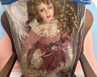Vintage porcelain doll . great condition