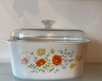 Vintage Corningware Wildflower A5B Nederlandse Oven 5 liter ovale braadpan bloemen glazen deksel jaren 1970 retro keuken kookgerei serviesgoed kookplaat veilig