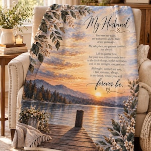 May include: A soft throw blanket featuring a scenic lake landscape at sunset with a wooden dock, framed by floral branches. The text reads: My Husband, You were my today, my tomorrow, and so many of my yesterdays. My safe place, my greatest comfort, my always.