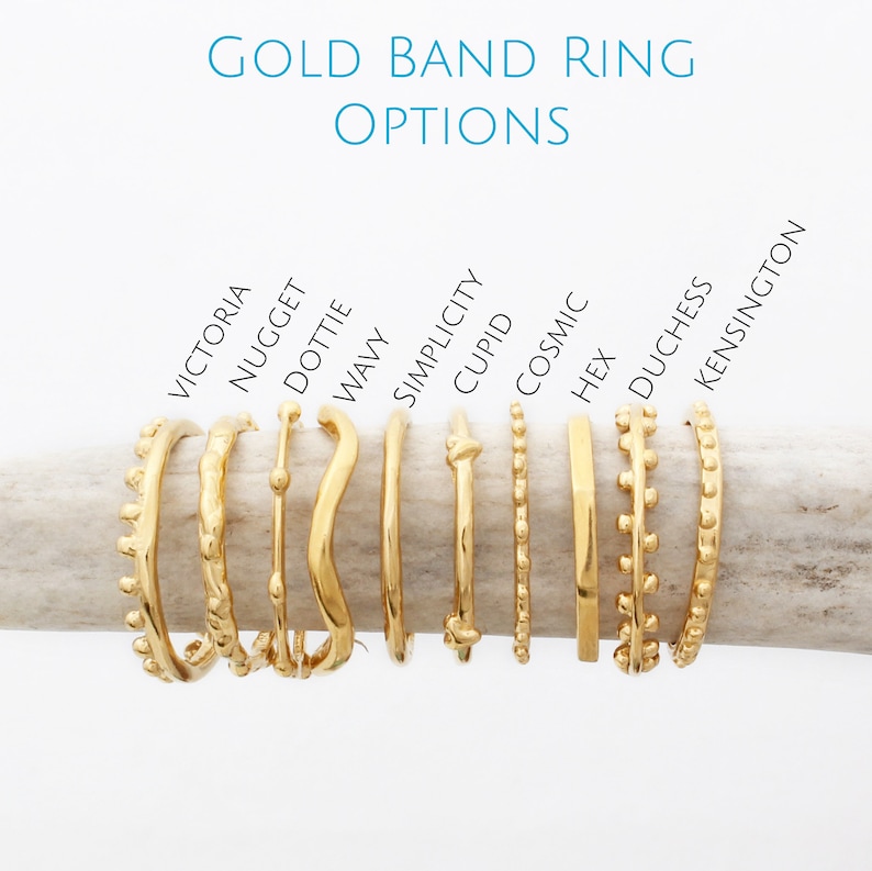 May include: Ten gold band rings with different designs, including a wavy ring, a ring with a knot, and a ring with a row of small beads. The rings are labeled with names like "Victoria", "Nugget", "Dottie", "Wavy", "Simplicity", "Cupid", "Cosmic", "Hex", "Duchess", and "Kensington".