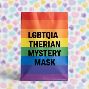 May include: A rectangular package with a rainbow design, with the text "LGBTQIA THERIAN MYSTERY MASK" in black. The background features a pattern of pastel hearts and paw prints.