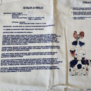 May include: A set of three ceramic mugs with a speckled, matte finish. The mugs are in shades of cream, light gray, and dark gray. Each mug has a simple, minimalist design, perfect for coffee or tea.