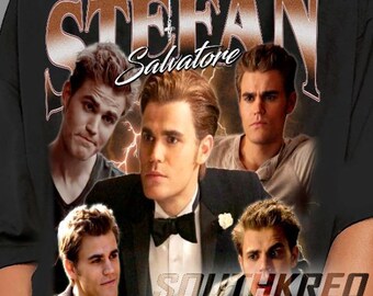 May include: Black oversized t-shirt with a vintage-style graphic of Stefan Salvatore from the TV show "The Vampire Diaries". The graphic features multiple images of Stefan Salvatore, with the text "Stefan Salvatore" in a brown gradient.