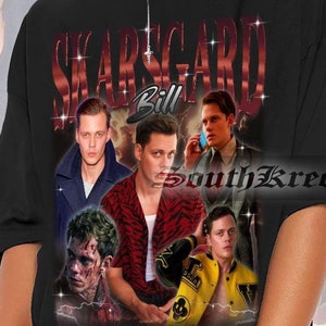 May include: Black oversized t-shirt with a graphic print of Bill Skarsgård's face in different roles. The text "Bill Skarsgård" is printed in red with a glittery effect.