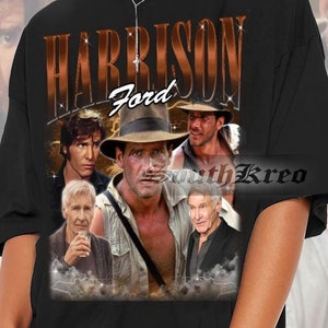 May include: Black oversized t-shirt with a collage of images of Harrison Ford, featuring the text "HARRISON Ford" in a brown, vintage-style font.