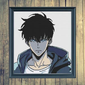 May include: Framed cross-stitch portrait of an anime character with black hair and blue eyes. The character is wearing a blue hooded jacket over a white shirt. The artwork is set against a wooden background.