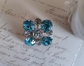 Vintage Baby Blue Rhinestone Brooch, Silver Tone, 1" Diameter Symmetric Design