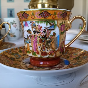 Pair of Rare vintage Chinese teacups. Hand painted with gold gilding featuring geisha girls by river.