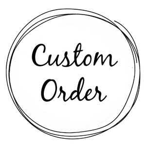 May include: A black and white image of a circle with the text "Custom Order" inside.