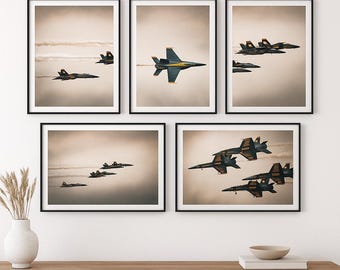 May include: Set of 5 framed prints featuring the Blue Angels. Each print showcases the iconic blue and gold jets in various formations against a cloudy sky. The text "BLUE ANGELS SET OF 5 PRINTABLE WALL ART" is displayed at the top.