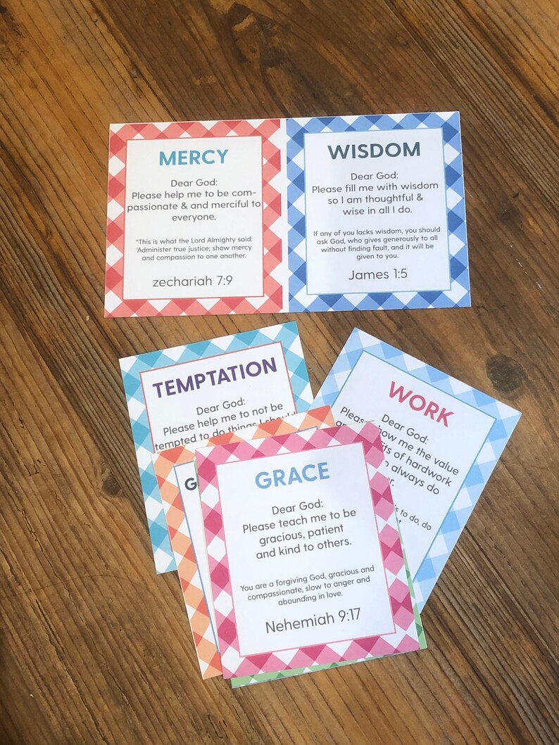 May include: Five colorful cards with a checkered pattern. Each card has a different word: Mercy, Wisdom, Temptation, Grace, and Work. Each card has a Bible verse and a message to God.