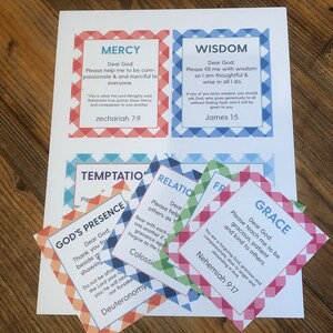 May include: A set of colorful cards with different Christian virtues printed on them, including Mercy, Wisdom, Grace, God's Presence, Temptation, and Relationships. Each card has a scripture verse and a short message.