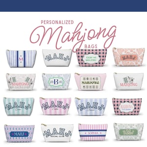 May include: A collection of personalized Mahjong bags in various designs. The bags feature different patterns, including stripes, floral prints, and geometric designs. Each bag has a zipper closure and includes text such as initials, names, or the words "Mahjong".