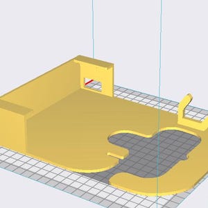 May include: A 3D-rendered yellow plastic object, possibly a bracket or holder, with a rectangular base and a curved, open-ended section. It features a small rectangular cutout and two upward-curving arms. The design suggests a functional, possibly electronic, component.