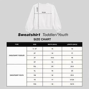 May include: A white long-sleeve sweatshirt displayed with a size chart for toddler and youth sizes. The chart lists types, sizes, and measurements in inches for width and length, ranging from 2T to 6T and YXS to YXL, with a diagram showing dimensions.