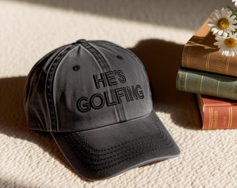 He's Golfing Embroidered Cotton Hat | Funny Golf Cap