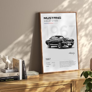 May include: A black and white poster featuring a 1967 Ford Mustang Shelby GT500. The poster includes the car's name, year, and specifications, including top speed, 0-100 km/h time, and power.