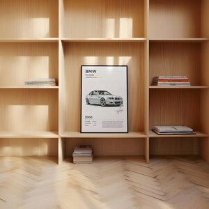 Puede incluir: Un p&oacute;ster en blanco y negro con un dibujo de un BMW M3 E46 blanco. El p&oacute;ster tiene el texto "BMW M3 E46" y "2000".