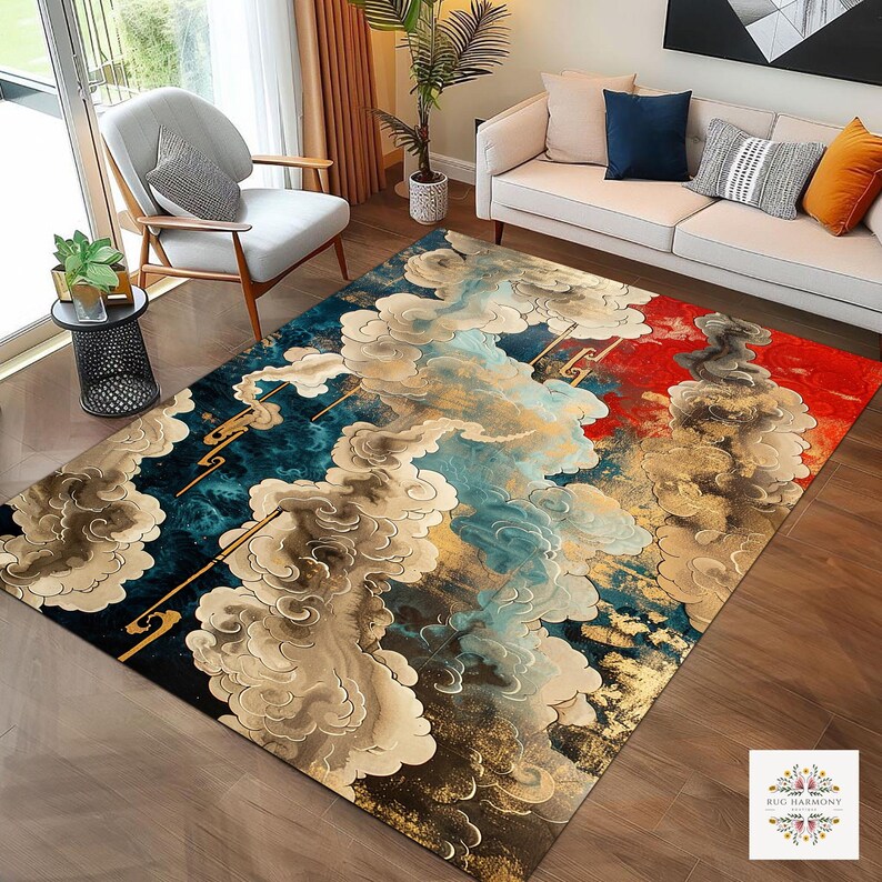 May include: A large area rug with a cloud design in shades of blue, gold, red, and beige. The rug features a detailed pattern with a mix of abstract and stylized cloud formations. The rug is placed on a hardwood floor, with furniture visible in the background.