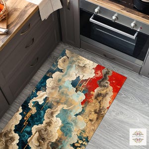 May include: A rectangular kitchen rug with a cloud design in shades of blue, gold, red, and white. The rug features an abstract pattern with a mix of colours and shapes, suitable for a kitchen or entryway.
