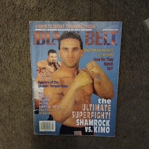 May include: Black Belt magazine cover featuring a photo of two men in fighting stances. The cover text reads "The Ultimate Superfight! Shamrock vs. Kimo".