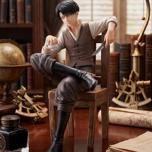 May include: A detailed figurine of a person seated on a wooden chair, holding a cup and a knife. The figure wears a white shirt, brown vest, and dark pants with black boots. The scene includes a desk with books, a globe, and a lamp.
