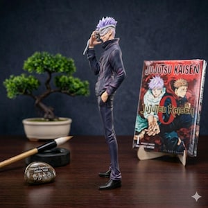 May include: A figurine of a character with purple hair and a mask, dressed in a dark jacket and trousers. A book titled "JUJUTSU KAISEN" is propped up nearby. A small bonsai tree and calligraphy brush are also in the scene.