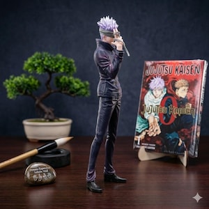 May include: A figurine of a character with spiky purple hair and a blindfold, dressed in a dark outfit, stands next to a manga volume titled "Jujutsu Kaisen." A bonsai tree and calligraphy tools are also visible.