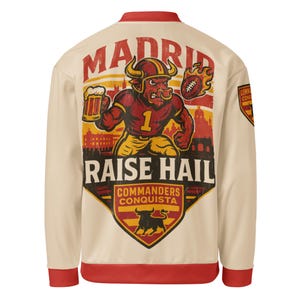 May include: Cream bomber jacket with red trim, featuring a large graphic on the back. The graphic shows a bull-like mascot holding a beer and a flaming football, with the words "MADRID" and "RAISE HAIL".