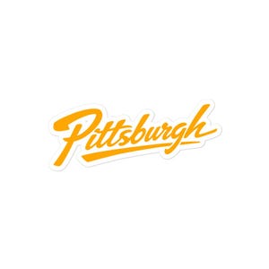 May include: A die-cut sticker featuring the word "Pittsburgh" in a vibrant, cursive font. The text is a bright yellow-orange, with a shadow effect, and is set against a white background.