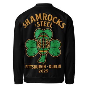 May include: Black bomber jacket with the text "SHAMROCKS & STEEL" in gold lettering. A green shamrock with a football design is centered on the back. The text "PITTSBURGH • DUBLIN 2025" is below the shamrock.