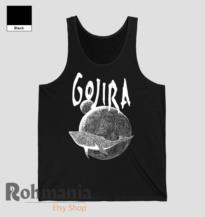 May include: Black tank top featuring the word "GOJIRA" in white script above a detailed white illustration of a whale swimming around a planet with a swirling design. The tank top is a solid black color.