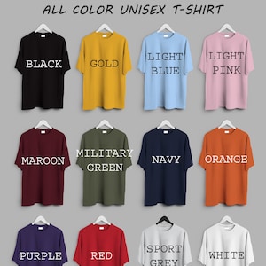 May include: A display of unisex t-shirts in various colors, including black, gold, light blue, light pink, maroon, military green, navy, orange, purple, red, sport grey, and white. The text "Rohmania Etsy Shop" is at the top.